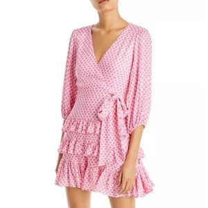 Aqua pink floral dress with ruffles and waist tie.